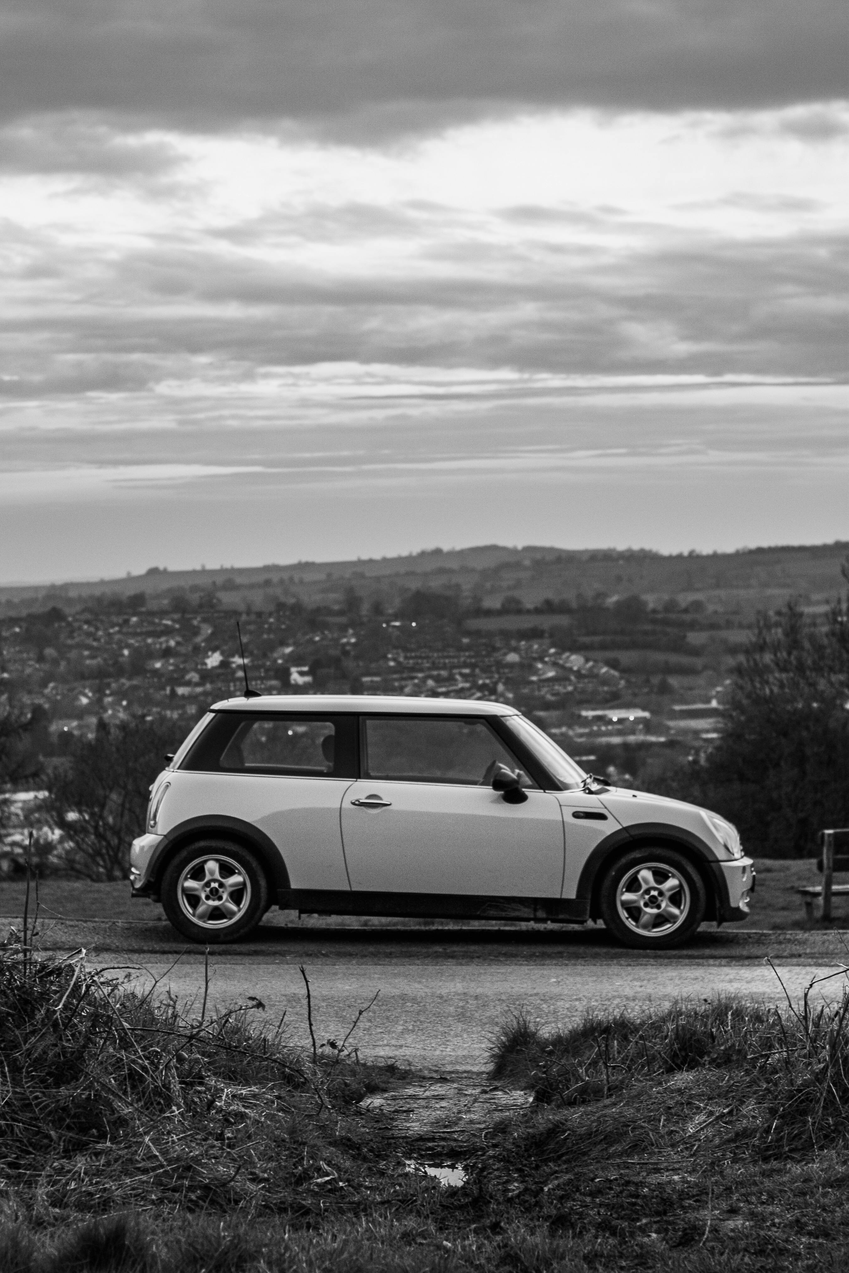 Clouds over Mini Cooper in Black and White · Free Stock Photo