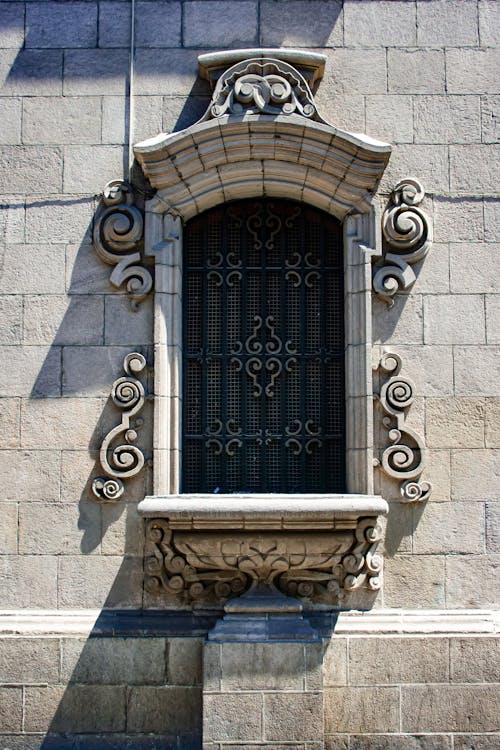 Ornate Window on a Stone Wall