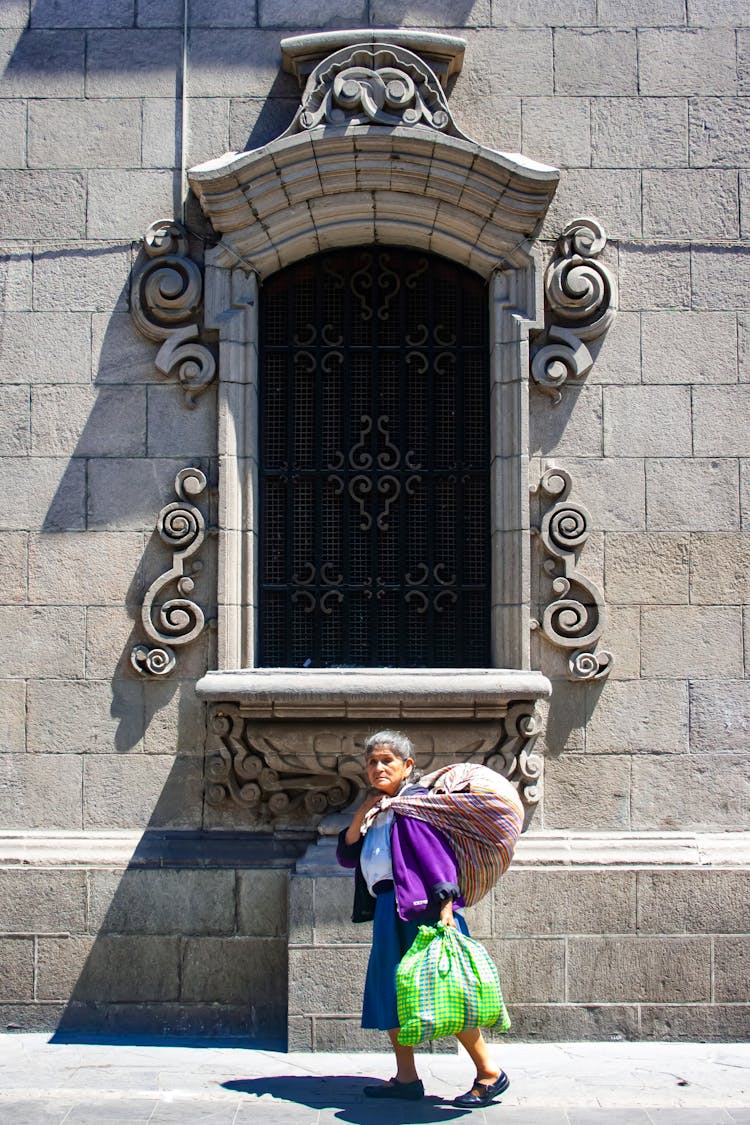 Elderly Woman Carrying Bags