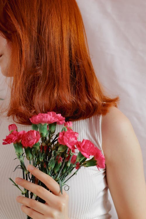 Flowers in Redhead Woman Hand
