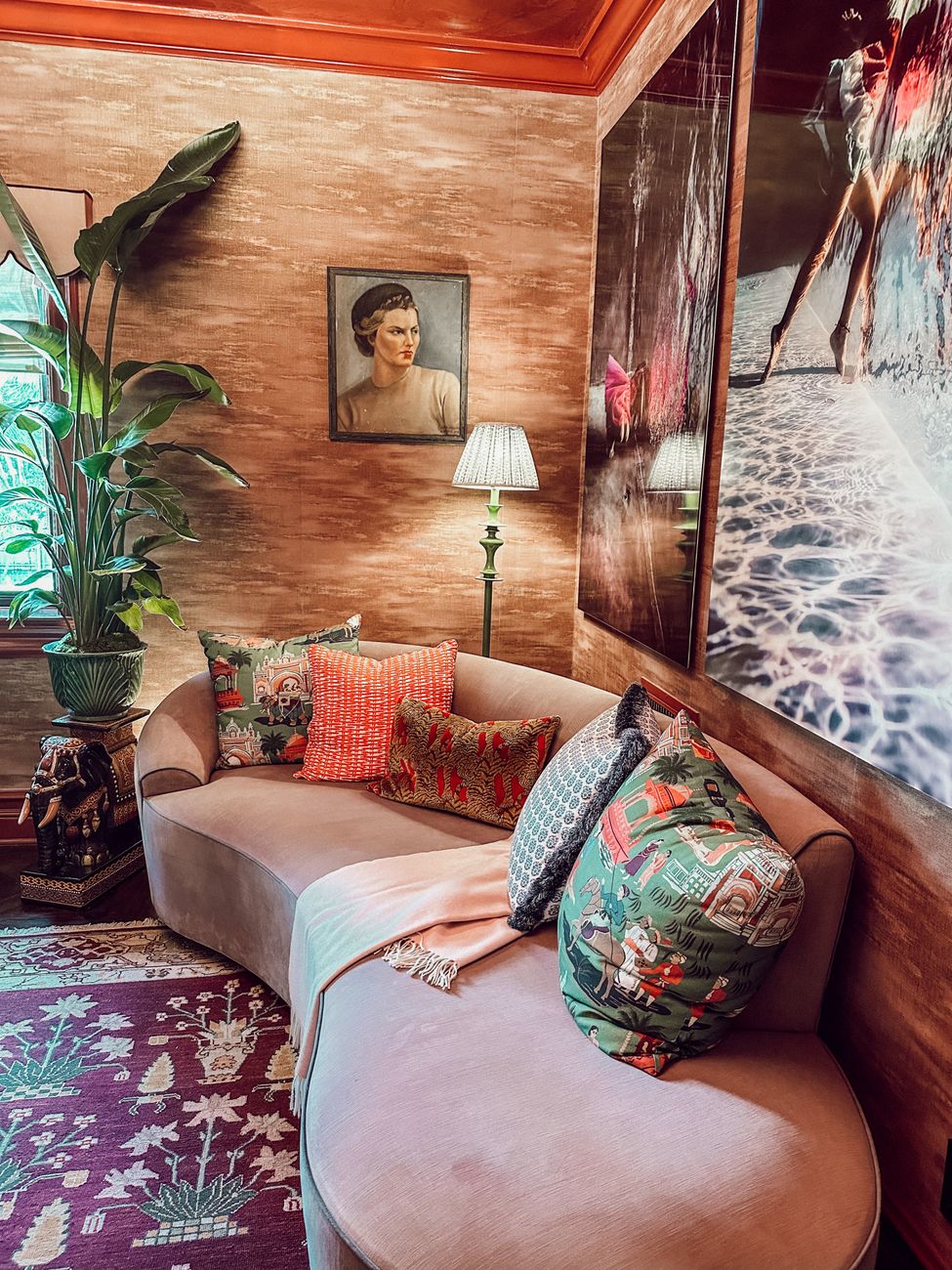 A warm living room with vintage furniture and plant life, arranged as a separate sitting zone