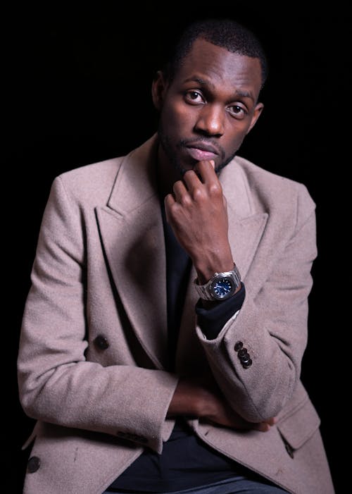 An Elegant Man in a Suit Posing in Studio 