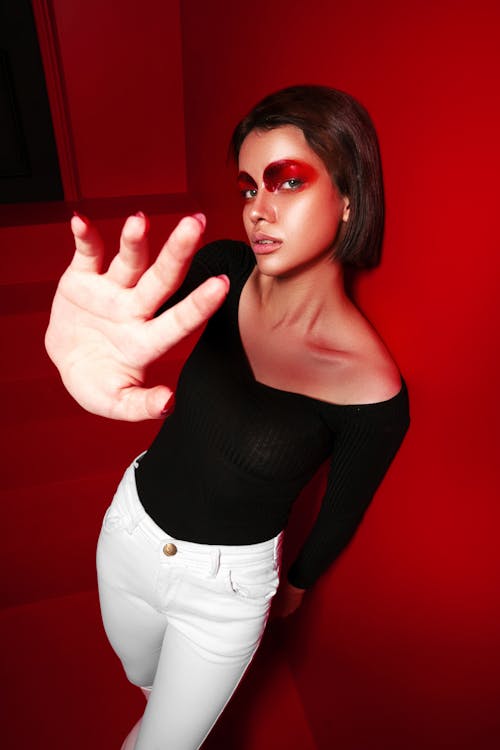 Woman Posing with Red Paint on Face