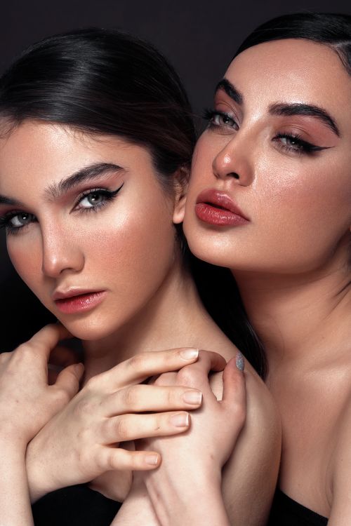 Free Close-up portrait of two women embracing, showcasing beauty and intimacy. Stock Photo