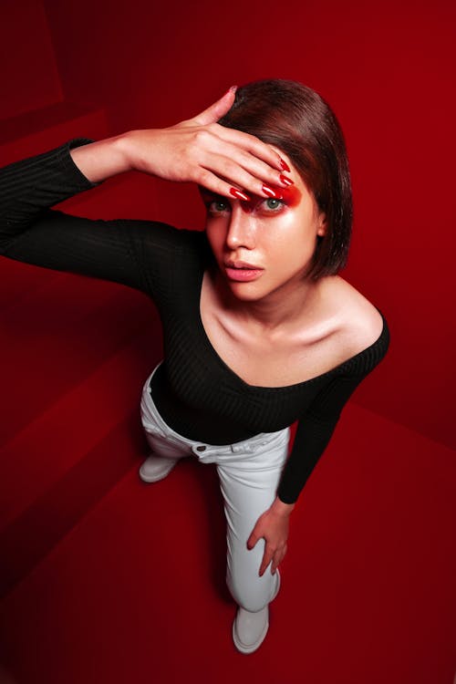 Woman Posing on Red Background