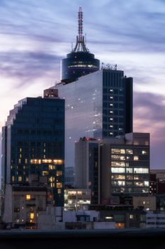 Dramatic view of the Mexico City skyline and skyscrapers at sunset.