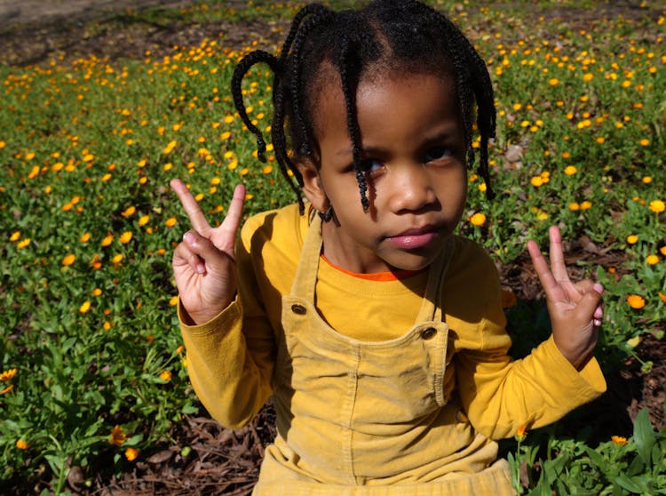 Portrait Of Girl Showing V Sign