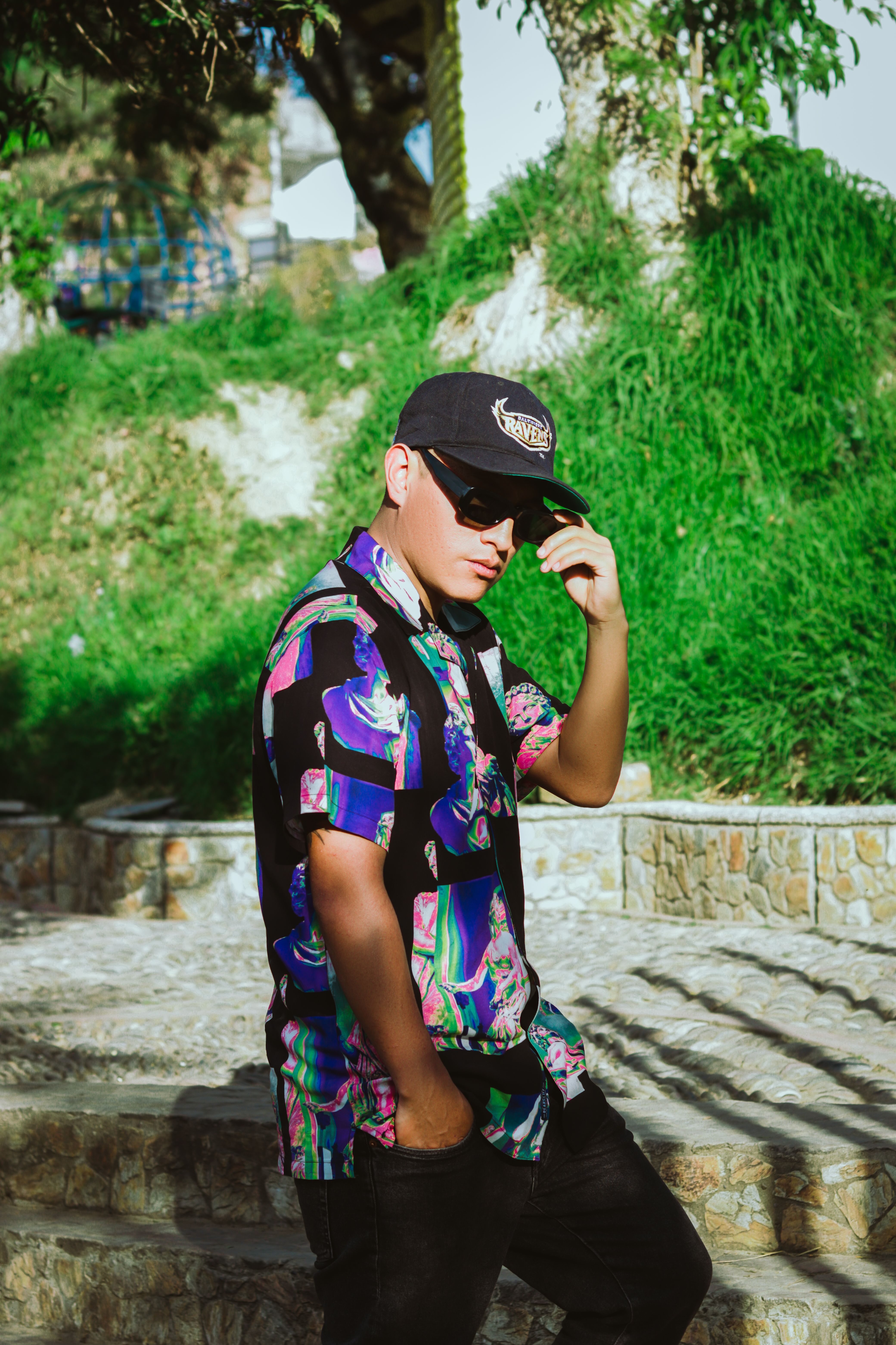 Man Posing in Cap and Shirt · Free Stock Photo
