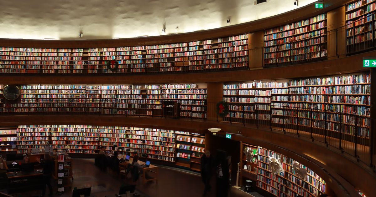 A vast collection of books lining the shelves of Stockholm's iconic public library.