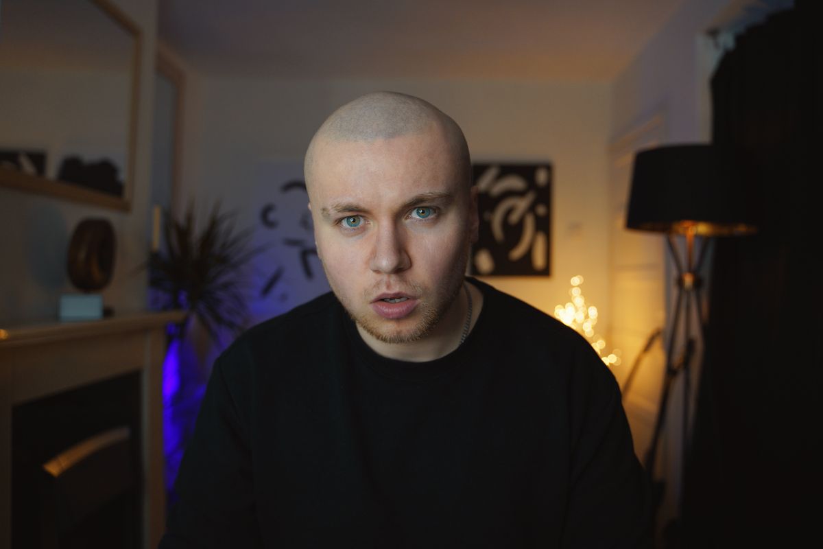 Cameron Gawn on Pexels — participant on a Pilverne call, seated in a lamp-lit room