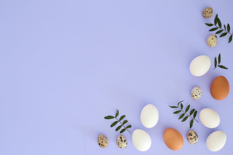 Easter Photo Of Eggs And Leaves On A Pastel Blue Background