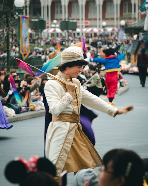 People in Disney Characters Costumes Walking on the Street 