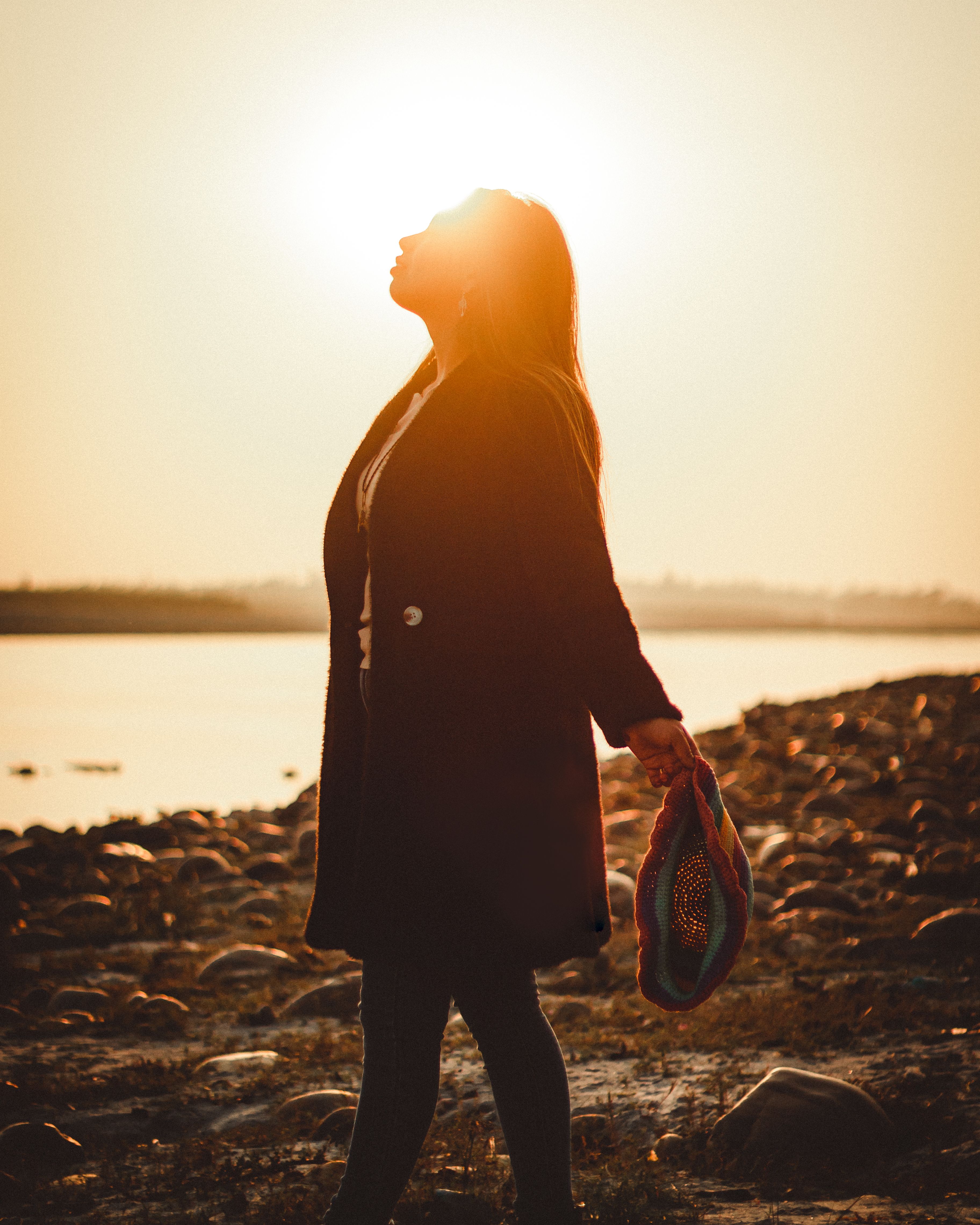 Young Woman on the Beach at Sunset · Free Stock Photo