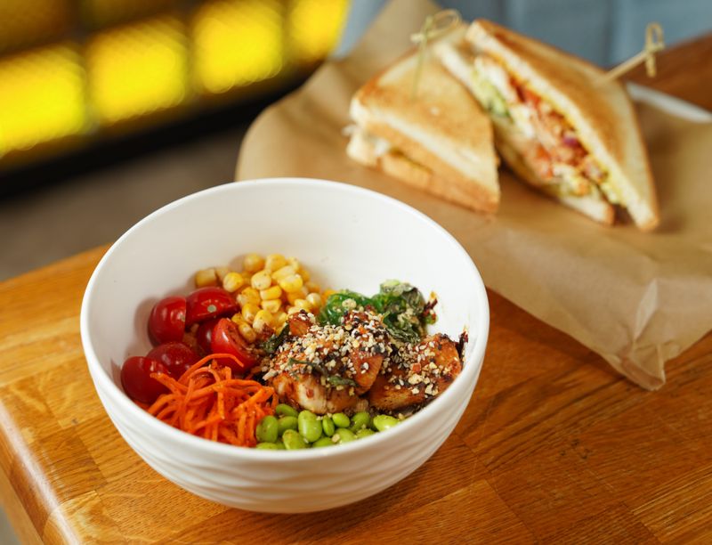 large salad topped with grilled chicken and chickpeas