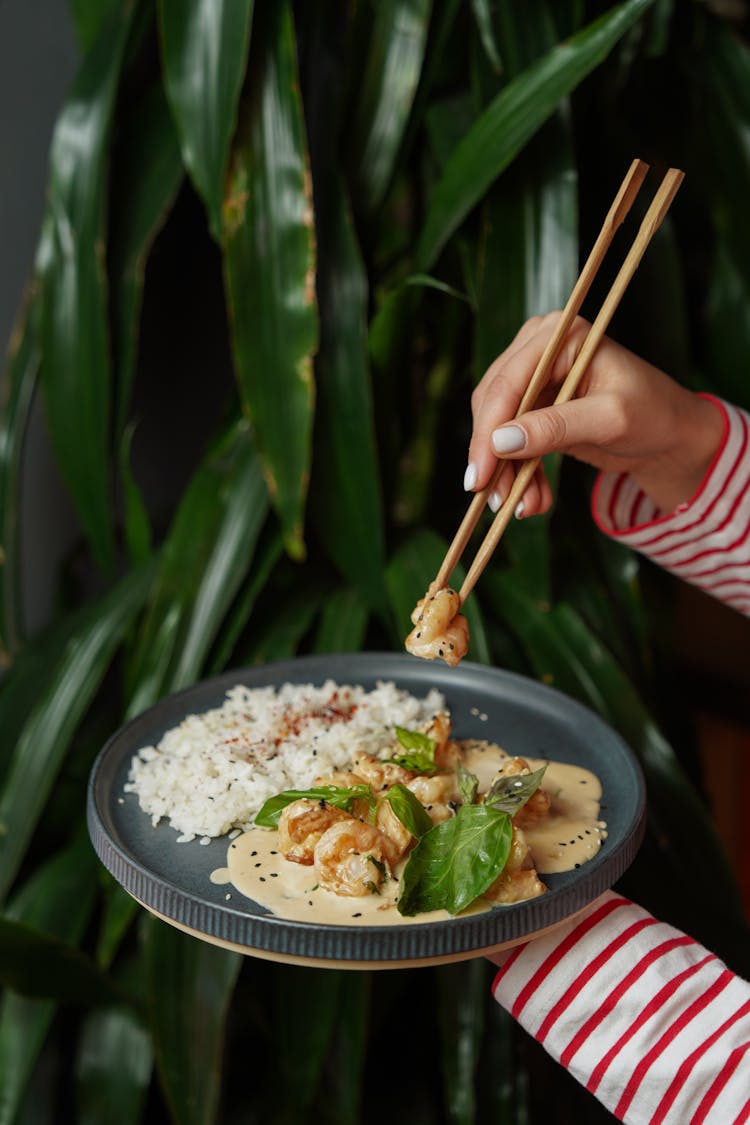 Hands Eating With Chopsticks