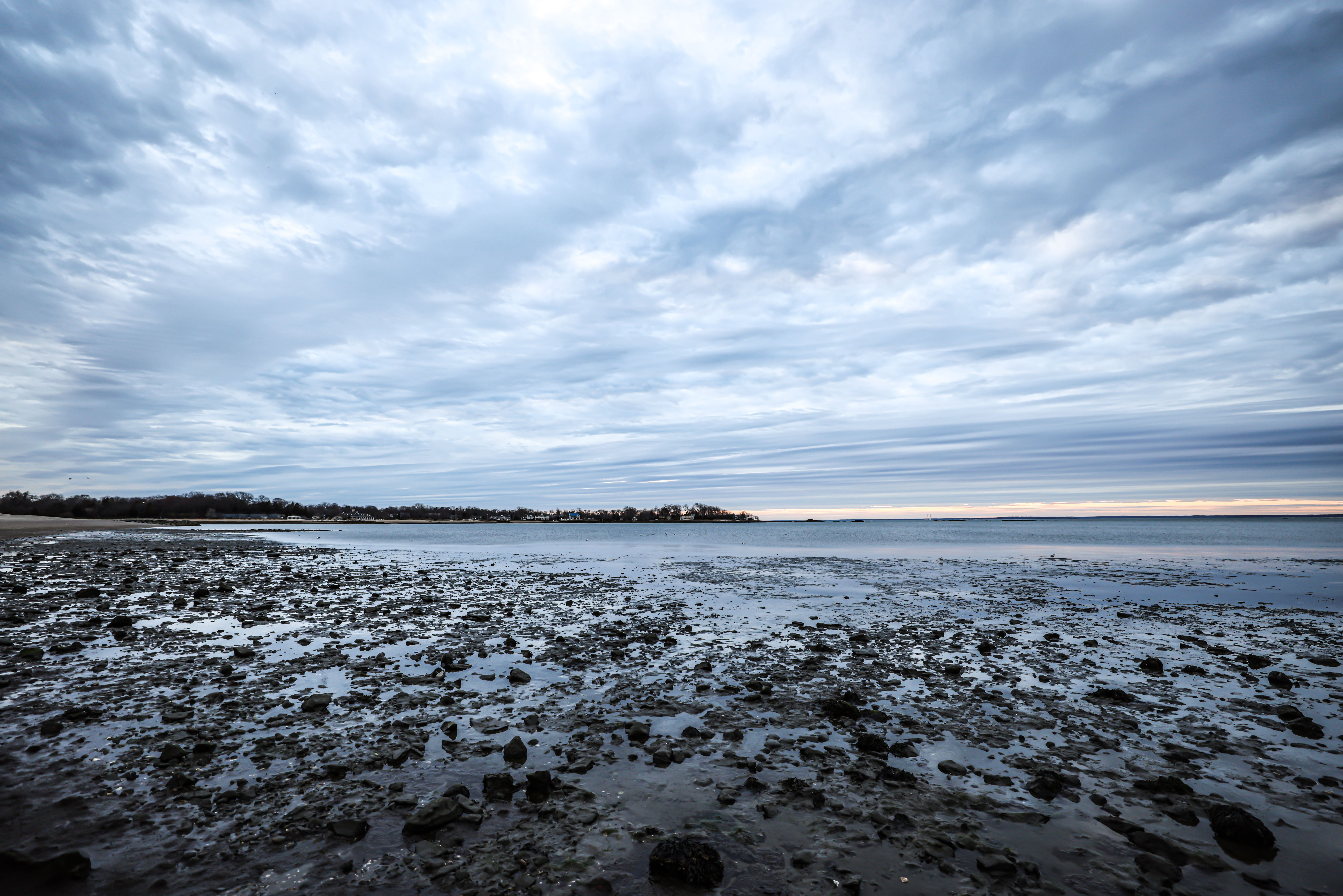 Empty Beach and Sea under an Overcast Sky · Free Stock Photo