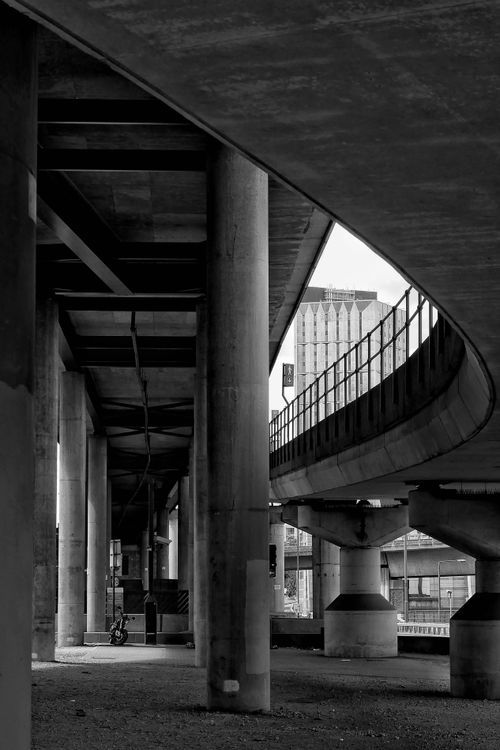Free Black and white view of elevated roads and pillars in London's urban landscape. Stock Photo