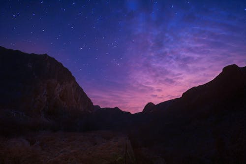 Pink Sunset Sky over the Silhouetted Mountains 