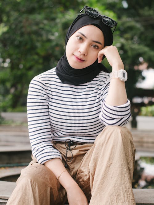 Woman in Hijab Sitting and Posing