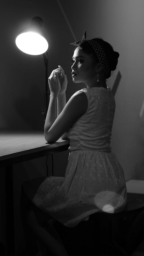 Black and White Studio Shot of a Young Elegant Woman in a Dress