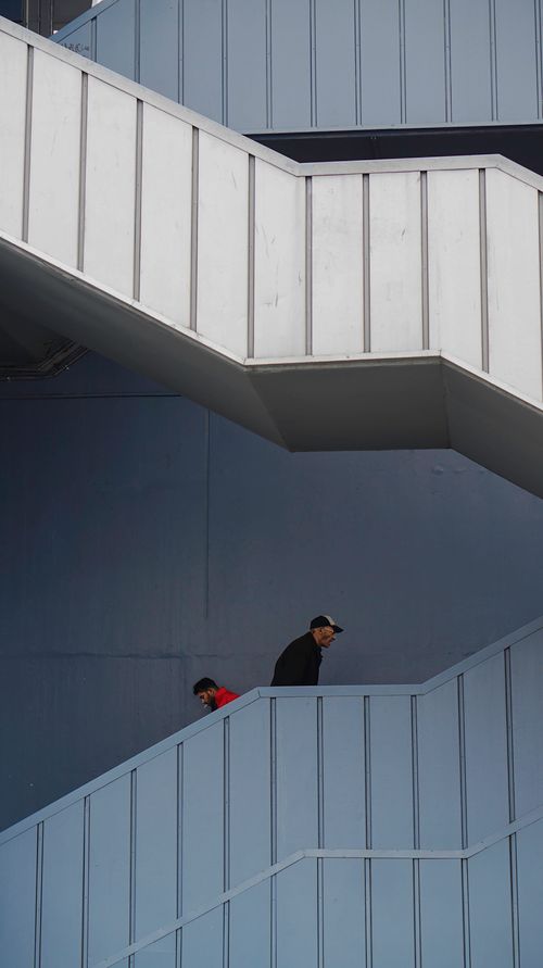 Free Vertical view of people walking down a modern staircase in Istanbul, Turkey. Stock Photo