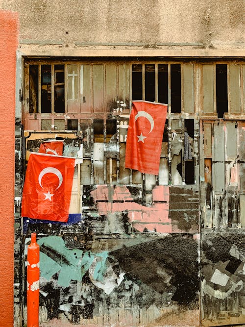 Turkish Flags Hanging on an Abandoned Building 
