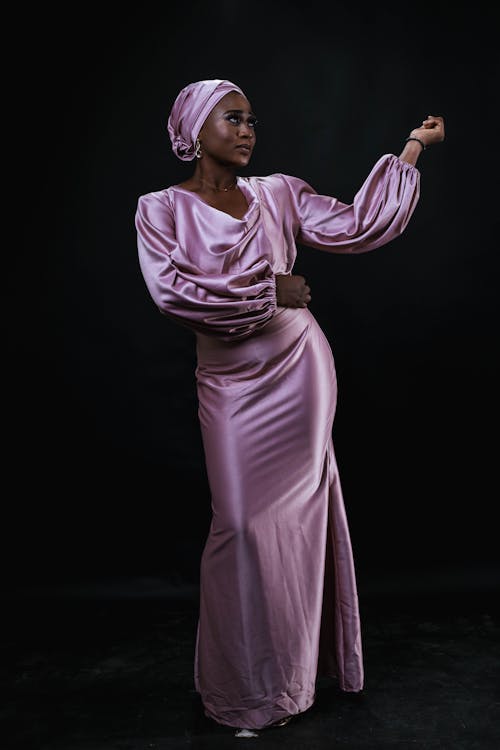 Young Woman Wearing a Pink Silk Dress and a Turban 