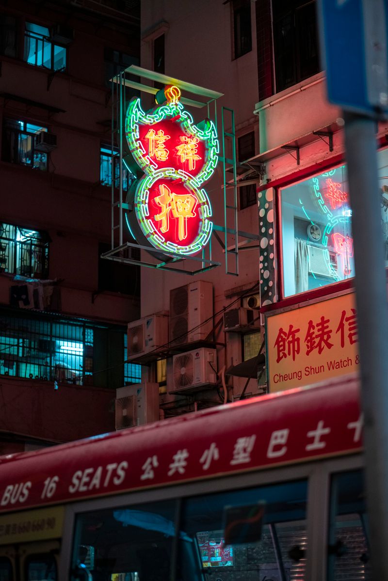 Colorful illuminated neon signs lighting up a Chinese street at night