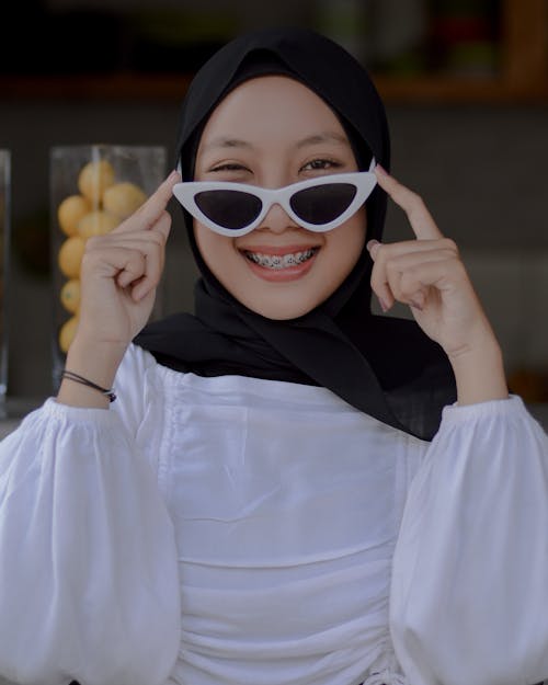 Smiling Woman in Sunglasses and Hijab
