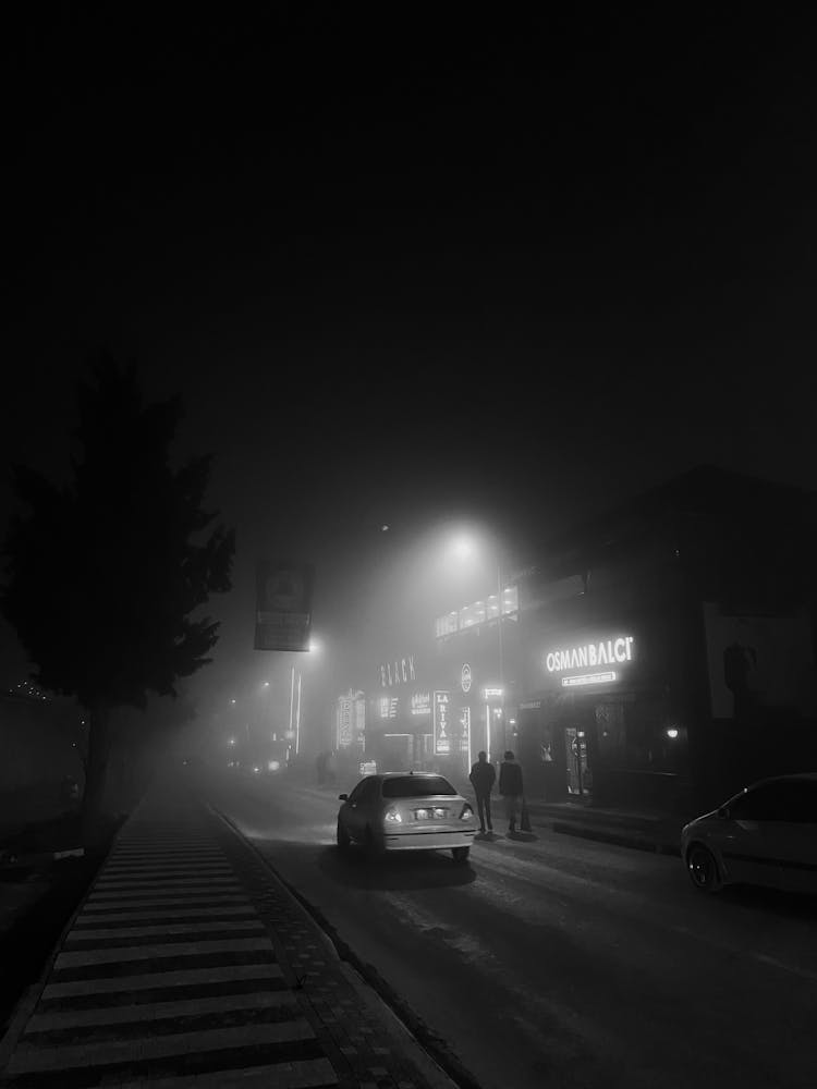 Car On Street In Town At Night