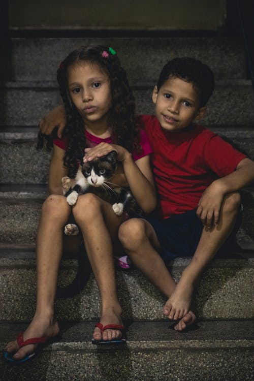 Boy and Girl Posing on Stairs