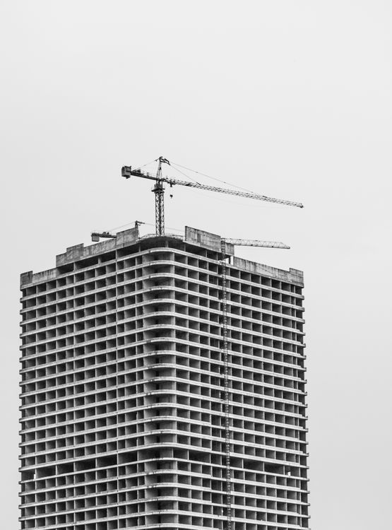 Construction Crane over Building in Construction in Black and White ...