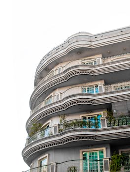 Curved balconies of a modern residential building in Dubai, UAE.