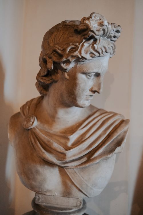 Free Close-up of a detailed marble bust representing Apollo, emphasizing classical art. Stock Photo