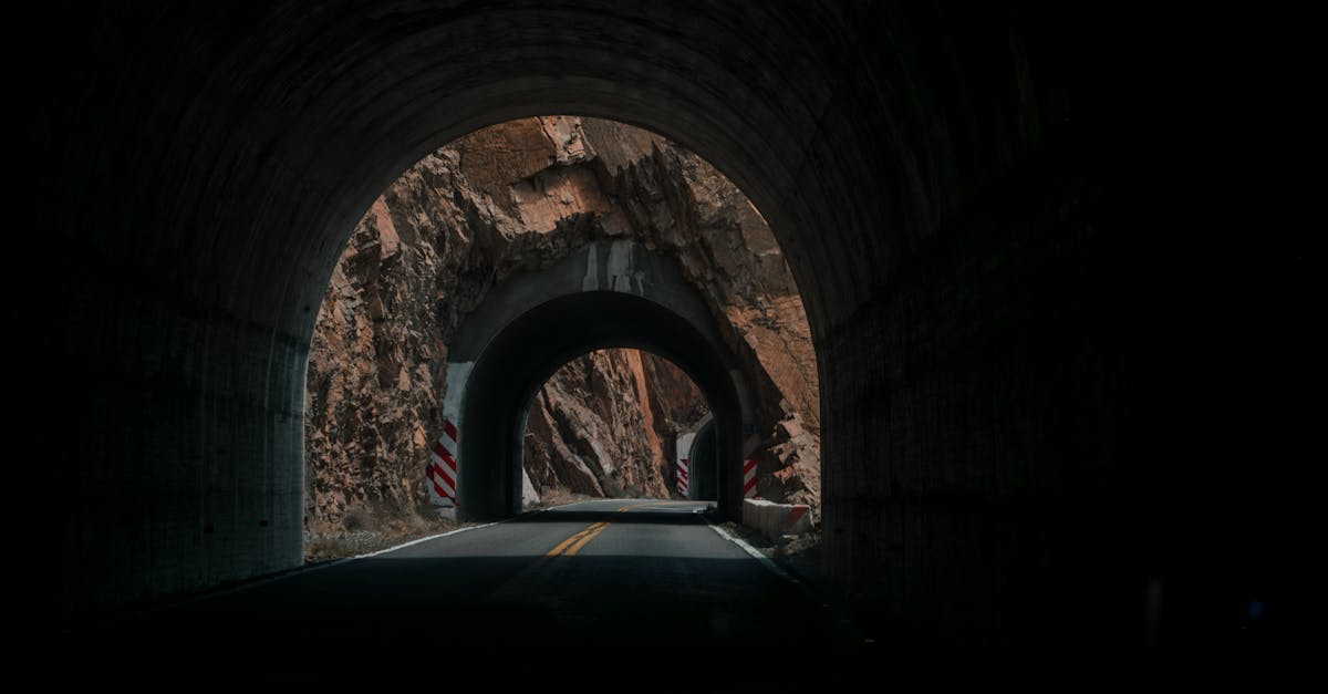 A dark, dramatic tunnel with rocky surroundings in Mendoza, Argentina.
