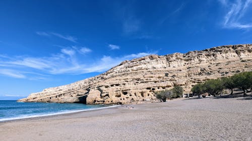 View of the Matala Beach with Cliffs and Caves, Crete, Greece