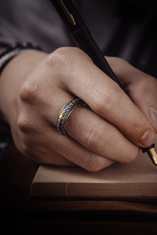 Close up of a Person Writing 
