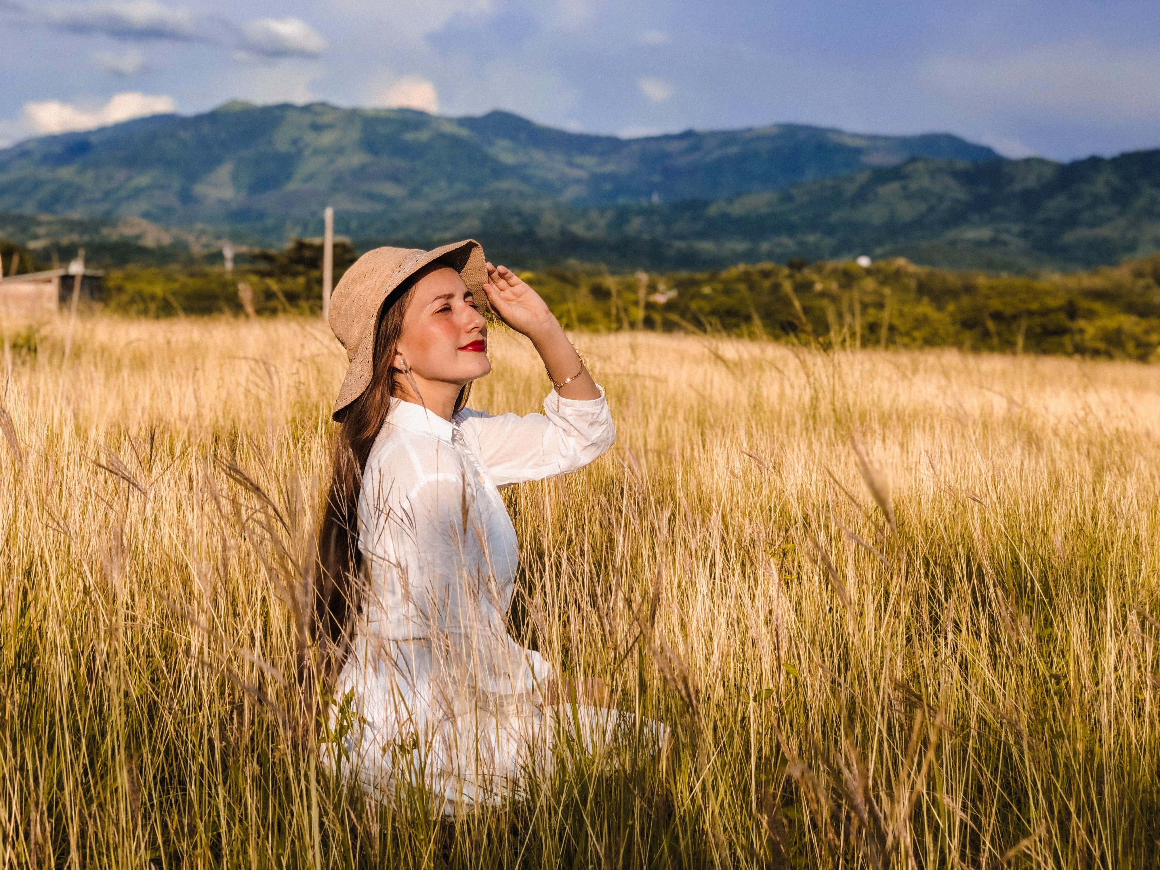 Woman Sitting in a Field in Summer · Free Stock Photo