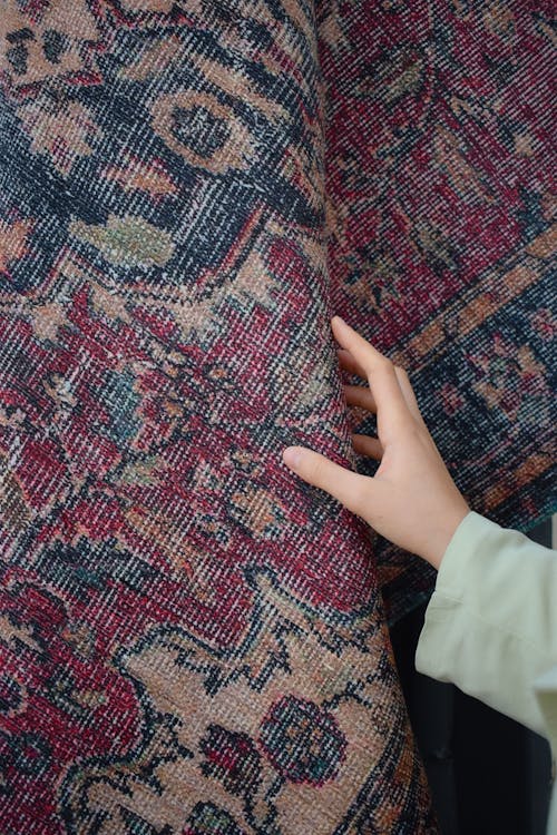 Woman Hand Touching Carpet