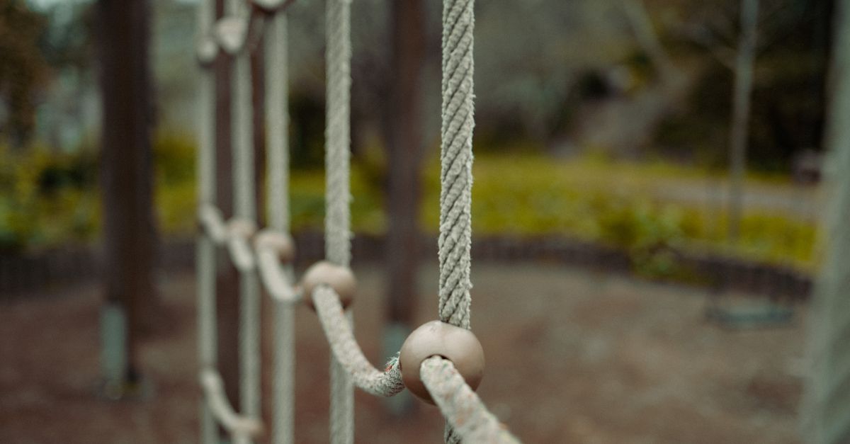 Close-up view of ropes on a playground equipment, showcasing the texture and connection.