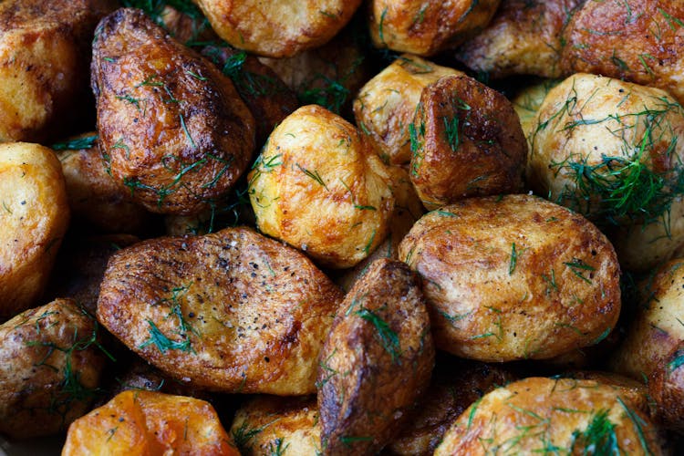 Baked Potatoes With Rosemary Garnish