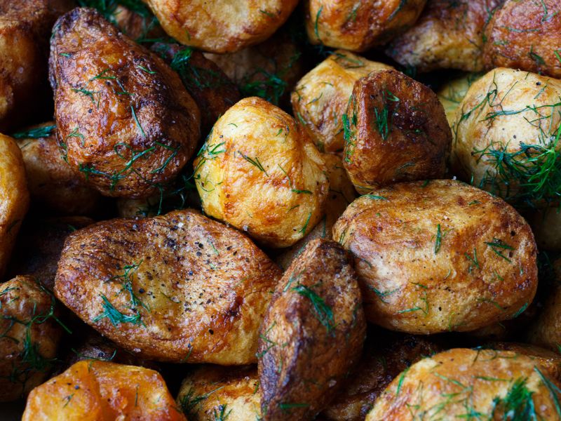 Deliciously crispy roasted potatoes seasoned with dill and spices.