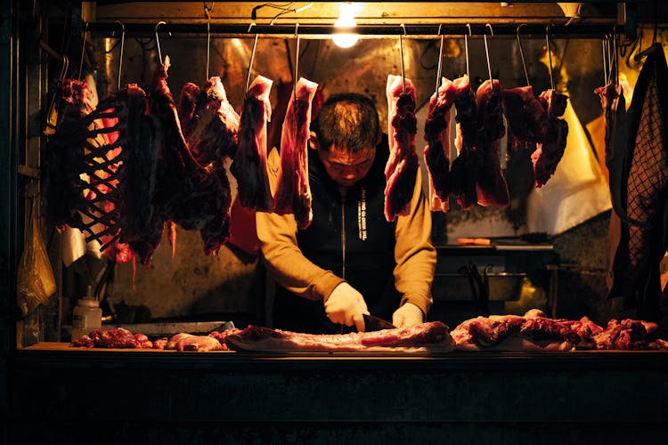 Butcher Cutting Meat