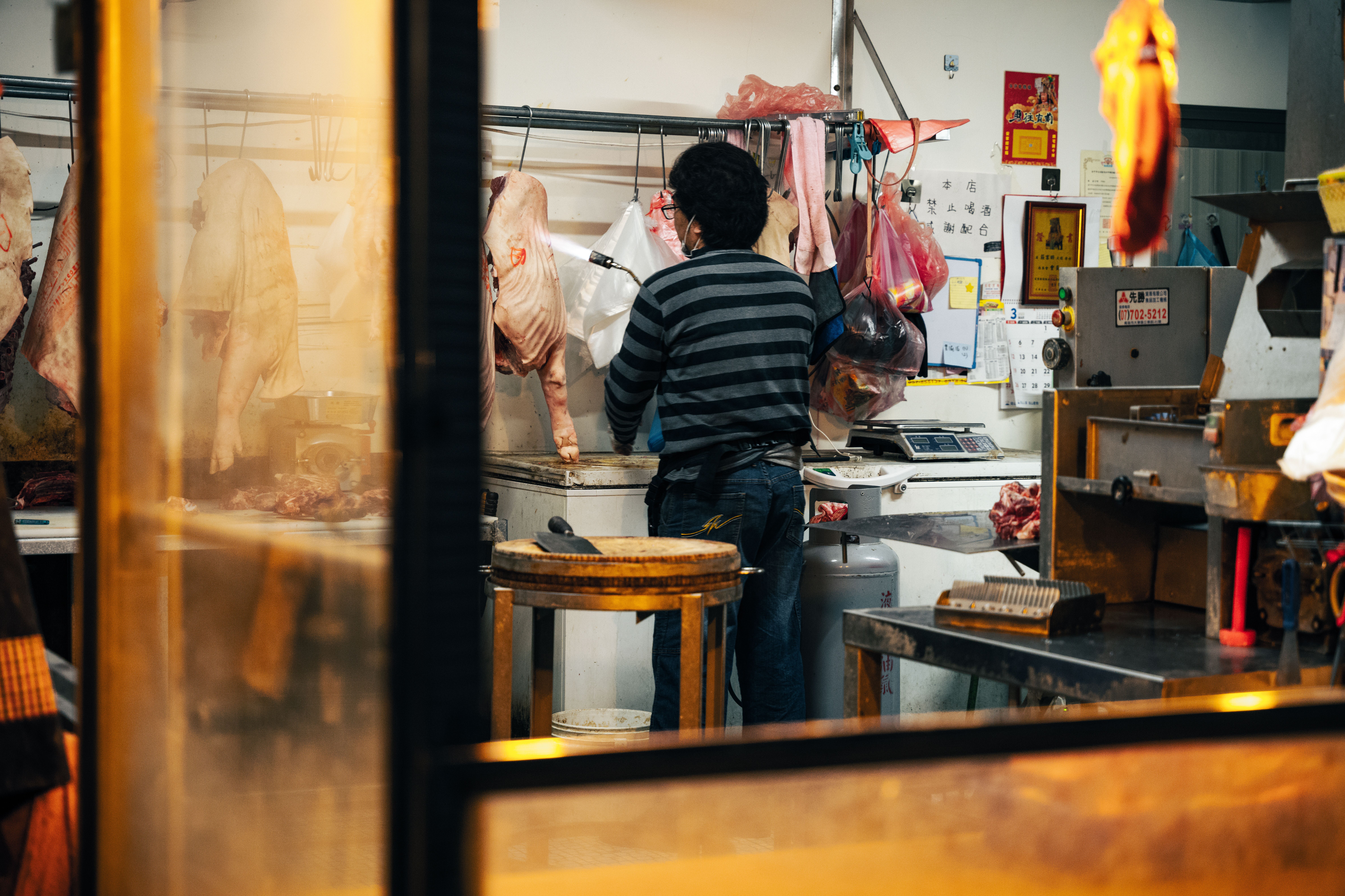Raw meat on a cutting board being inspected for freshness