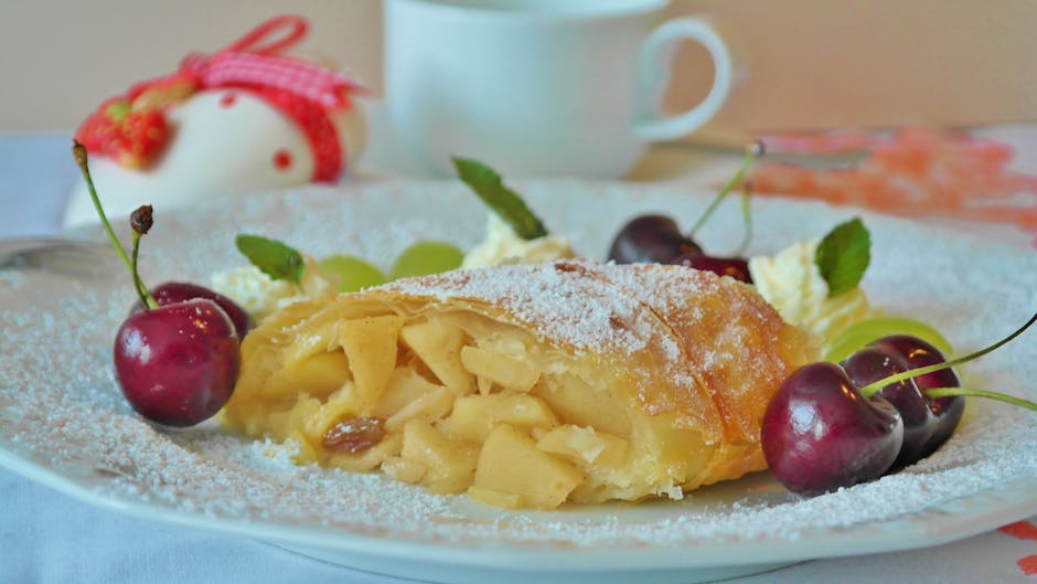 Yellow Pastry and Red Cherry in White Ceramic Dining Plate