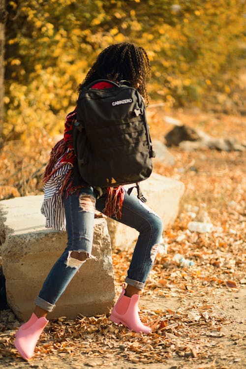 Woman Holding Black Backpack