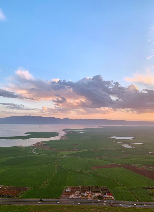Free Breathtaking aerial landscape of Lake Dukan in Ranya, Iraq at sunset, surrounded by vibrant fields. Stock Photo