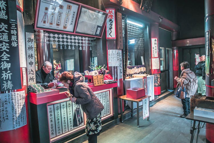 Person Showing Japanese Food Stalls