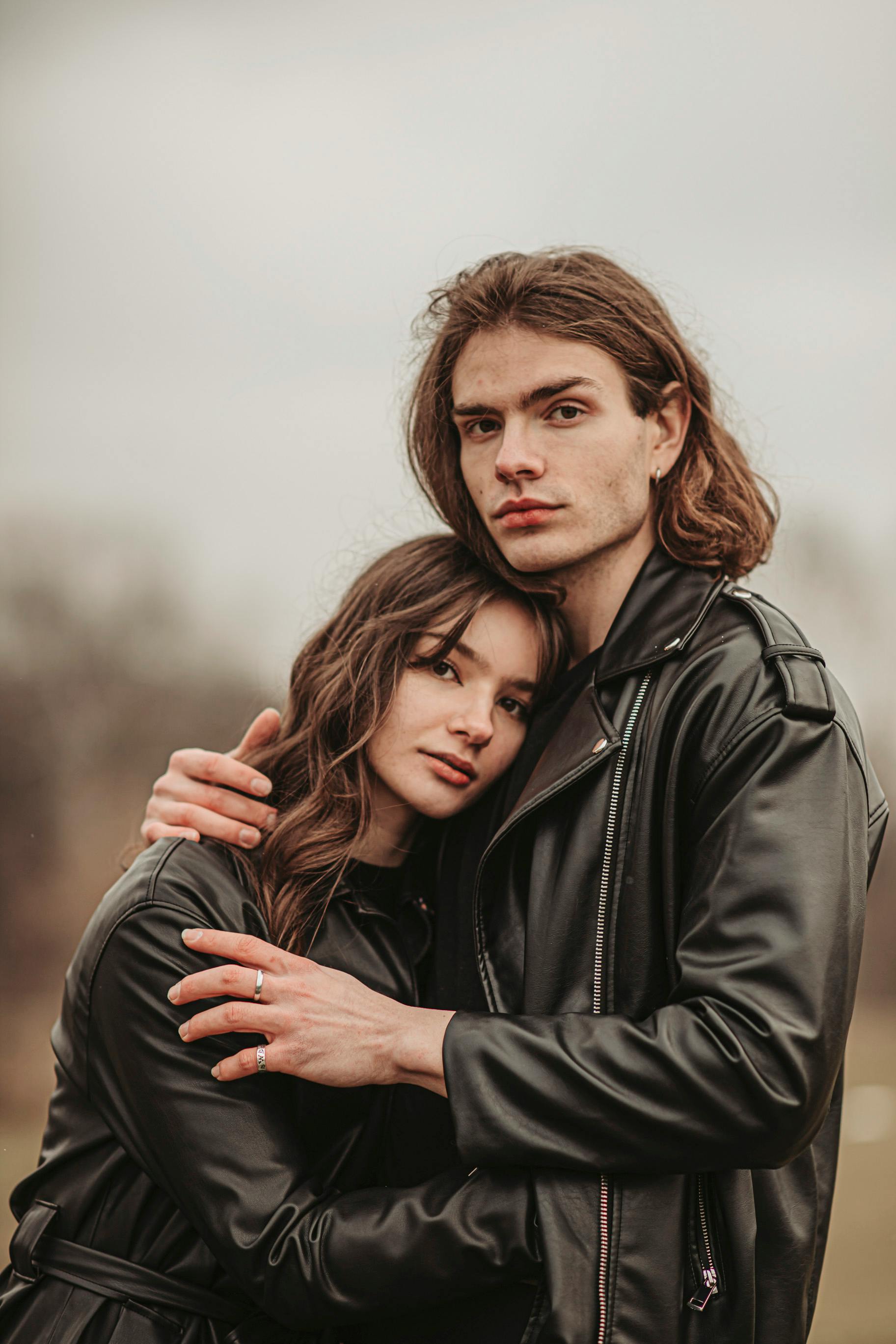 Beautiful Fashionable Couple In Leather Jackets Sitting Free Stock Photo  and Image 242882918