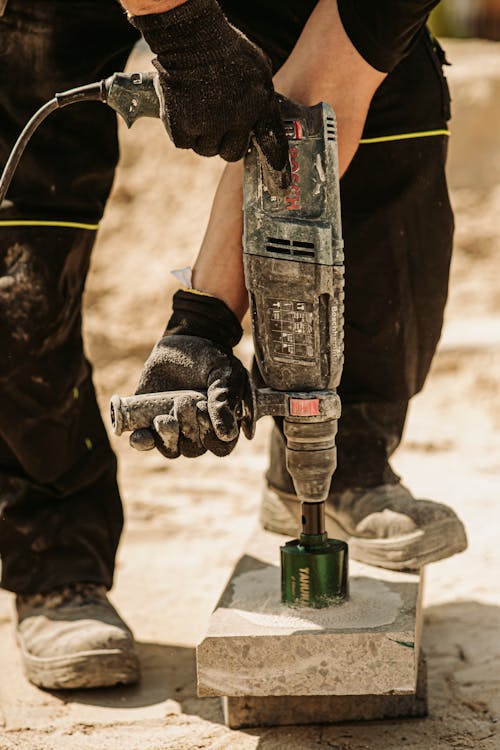 A Person Using a Demolition Hammer